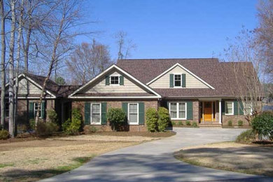Inspiration for a mid-sized timeless brown two-story brick gable roof remodel in Atlanta