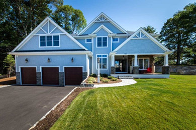 Inspiration for a craftsman blue two-story mixed siding exterior home remodel in Boston with a hip roof