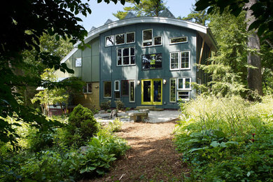 Example of an eclectic two-story exterior home design in Other