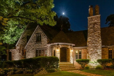 Example of a french country exterior home design in Milwaukee