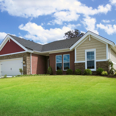 Small arts and crafts red one-story mixed siding exterior home photo in Other