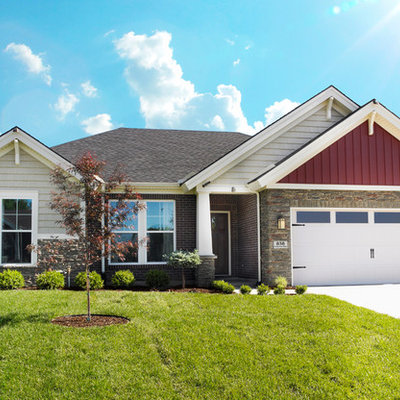 Mid-sized arts and crafts red one-story mixed siding exterior home photo in Other
