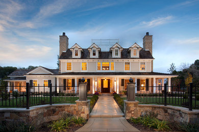 Example of a large classic beige three-story mixed siding exterior home design in Salt Lake City