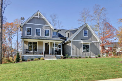 Example of a farmhouse gray three-story mixed siding exterior home design in Richmond with a mixed material roof