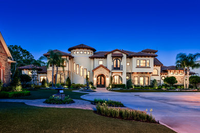 Example of a tuscan exterior home design in Houston