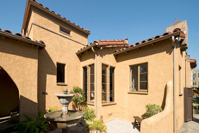 Photo of a mediterranean bungalow house exterior in Los Angeles.