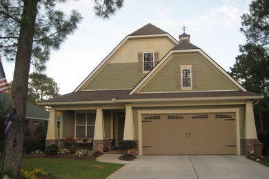 Arts and crafts exterior home photo in Charlotte with a clipped gable roof