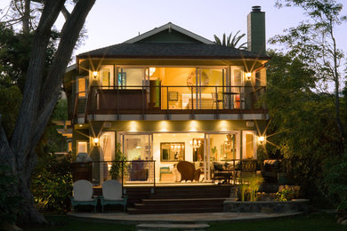 Inspiration for a large coastal green two-story wood exterior home remodel in Santa Barbara