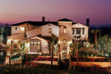 Inspiration for a large two-story gable roof remodel in San Diego