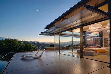 Large minimalist multicolored two-story glass exterior home photo in San Francisco