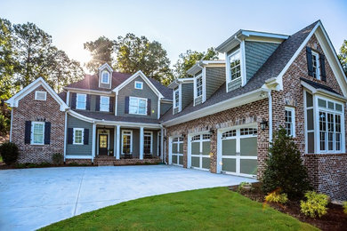 Example of a large transitional gray two-story brick exterior home design in Atlanta