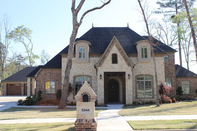 Example of a large classic two-story mixed siding exterior home design in Austin