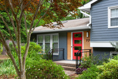 Inspiration for a mid-sized contemporary blue two-story mixed siding exterior home remodel in Raleigh with a shingle roof