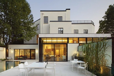 Contemporary beige stone exterior home idea in Toronto