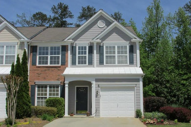 Example of a large classic gray two-story mixed siding exterior home design in Atlanta with a shingle roof