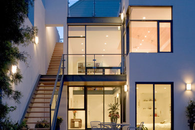 Trendy white two-story exterior home photo in San Francisco