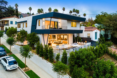 Foto de fachada de casa multicolor minimalista grande de dos plantas con revestimientos combinados y tejado plano