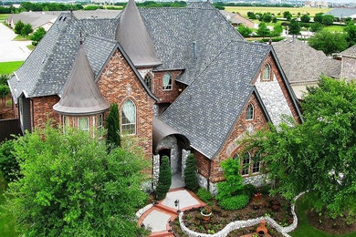 Traditional Brick Home with Spires & Tile Roofing