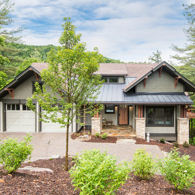 Mid-sized craftsman beige two-story wood exterior home idea in Other with a mixed material roof