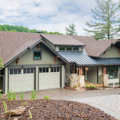 Inspiration for a mid-sized craftsman beige two-story wood exterior home remodel in Other with a mixed material roof