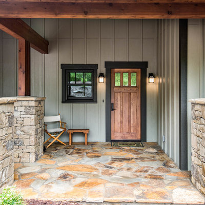Inspiration for a mid-sized craftsman beige two-story wood exterior home remodel in Other with a mixed material roof