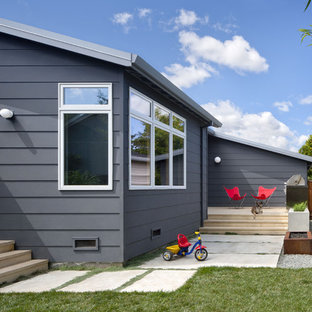 Gey classic one floor house exterior in San Francisco with concrete fibreboard cladding.