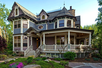 Large victorian purple two-story wood exterior home idea in New York