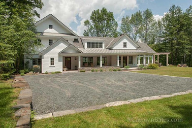 Elegant white three-story wood exterior home photo in Burlington