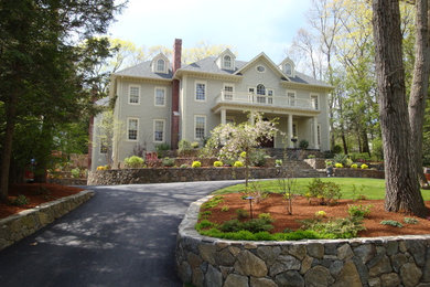 Example of a huge classic beige two-story wood exterior home design in Boston
