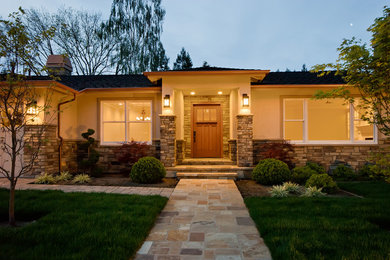 Inspiration for a large timeless beige one-story mixed siding exterior home remodel in San Francisco with a shingle roof