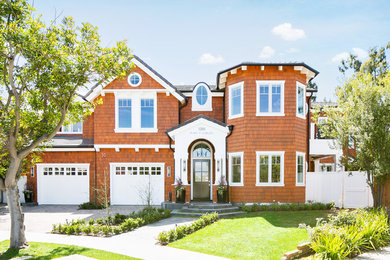 Example of a classic brown two-story exterior home design in Orange County
