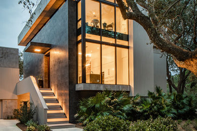 Inspiration for a contemporary gray two-story house exterior remodel in Charleston