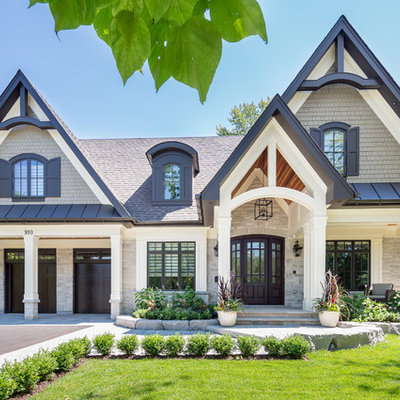Large transitional beige two-story wood gable roof photo in Toronto