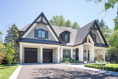 Inspiration for a large transitional white two-story wood exterior home remodel in Toronto