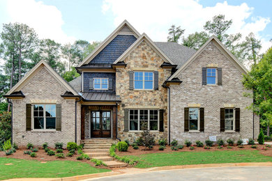 Example of a transitional two-story mixed siding gable roof design in Atlanta