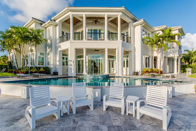 Transitional white two-story exterior home idea in Miami