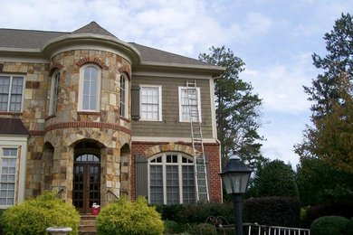 Transitional beige two-story wood house exterior idea in Atlanta