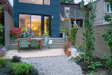 Small contemporary two-story townhouse exterior idea in Toronto