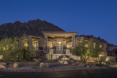 Huge contemporary beige one-story stucco flat roof idea in Phoenix