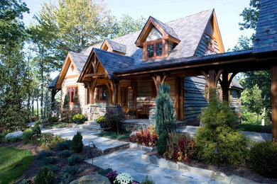 Mountain style gray split-level wood exterior home photo in Charlotte