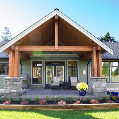 Example of a classic green exterior home design in Vancouver