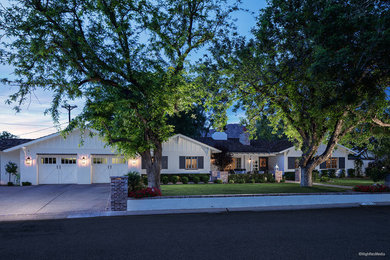Inspiration for a large farmhouse white one-story wood exterior home remodel in Phoenix