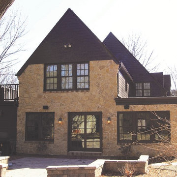 Tudor Revival Central Passage Home - Brown Gable Roof & Sand Color Stone Facing