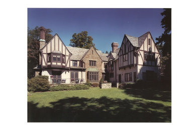 Example of a large classic two-story wood exterior home design in New York