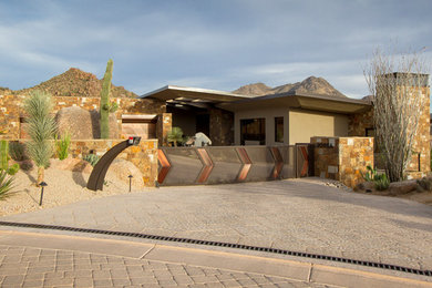 Trendy house exterior photo in Phoenix with a shed roof