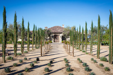 Photo of an expansive mediterranean bungalow house exterior in Los Angeles.