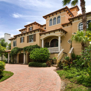 Example of a large tuscan exterior home design in Tampa