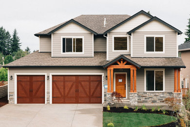 Inspiration for a mid-sized craftsman gray two-story mixed siding gable roof remodel in Portland