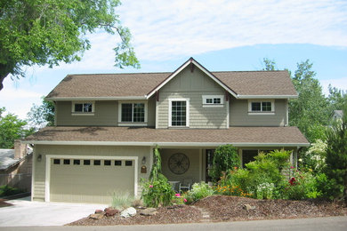 Mid-sized arts and crafts green two-story concrete gable roof photo in Denver