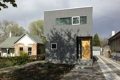 Mid-sized minimalist gray two-story stucco exterior home photo in Salt Lake City